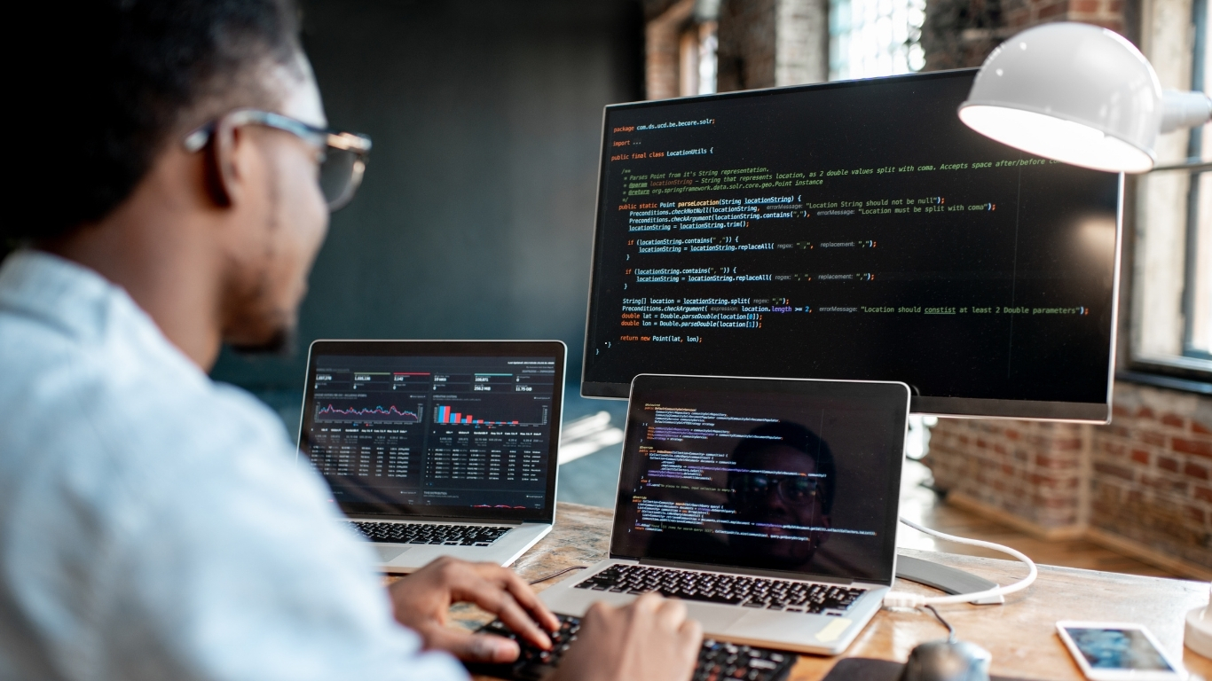 Developer workspace with code on screen